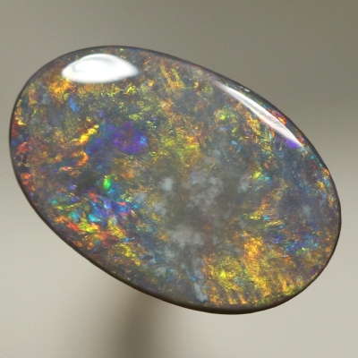 SOLID BLACK OPAL Golden fire over peacock blue